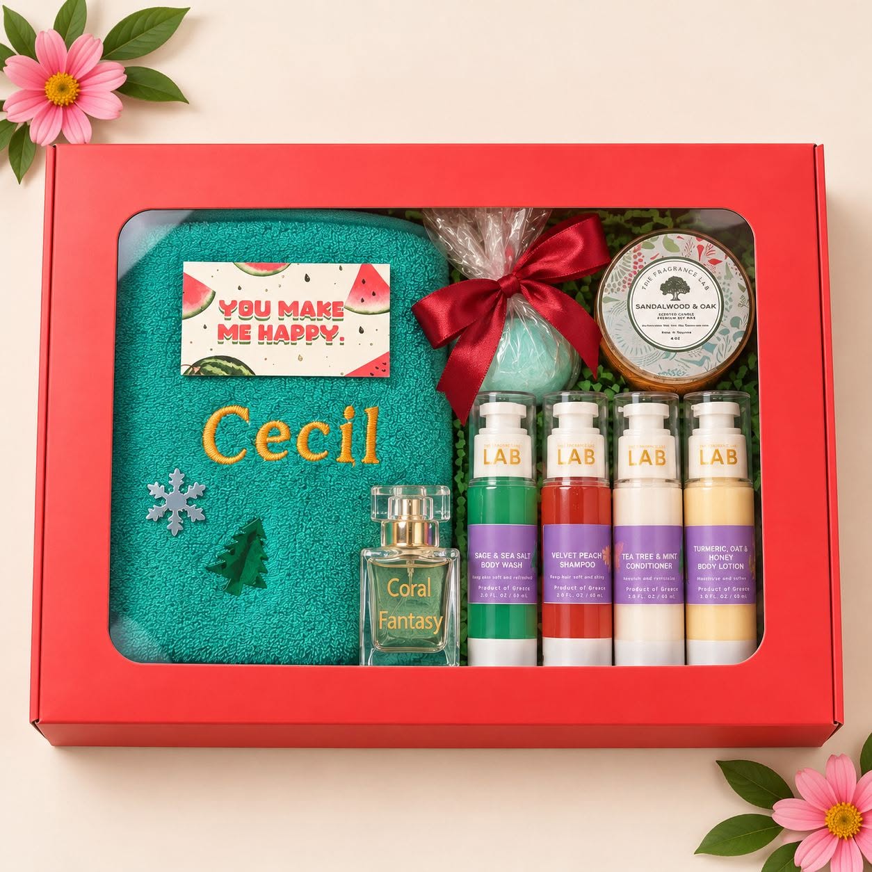 Red personalised gift box with an embroidered towel, perfume, bath products and candle